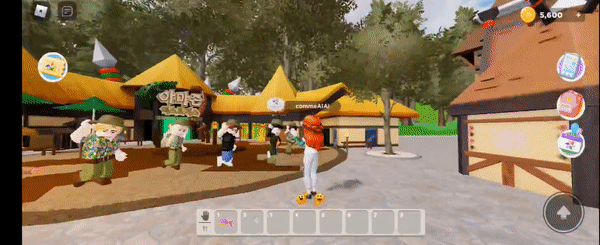 추후 '메타에버랜드'에 개발될 아마존 익스프레스 앞에서 춤을 추고 있는 아바타들에게 박수를 보내고 있는 모습. (사진=로블록스 플래이댑 랜드 캡처).