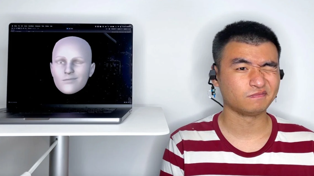 Wearing a device developed by Cornell University to capture facial expressions (Photo = Cornell)